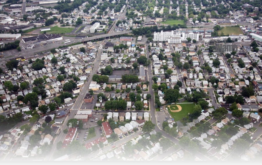A breathtaking panoramic view of Union City, NJ at dusk, capturing a sweeping urban landscape with a mix